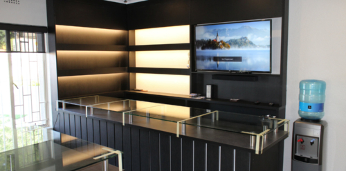 Shelving with concealed lighting & TV fitted