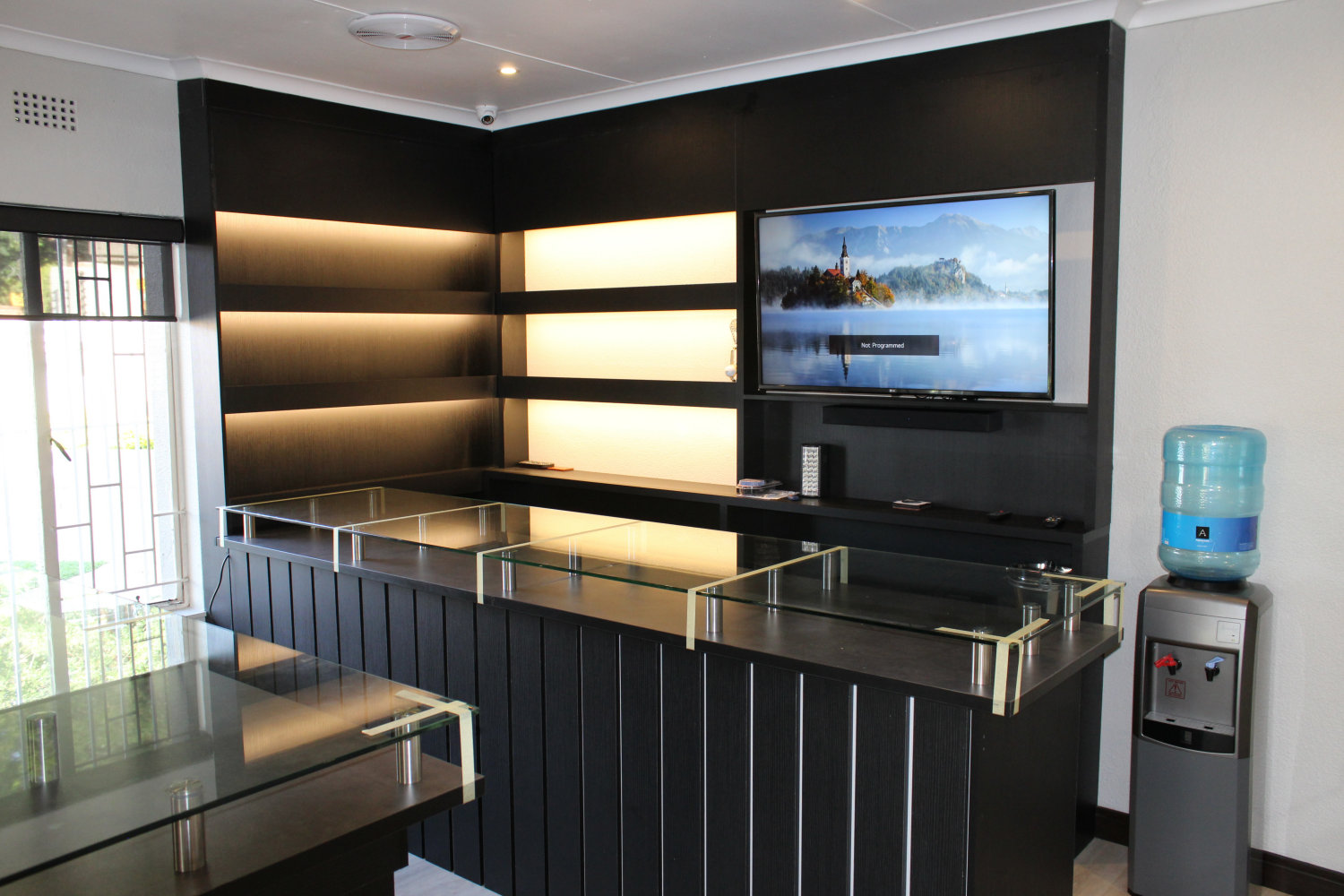 Shelving with concealed lighting & TV fitted
