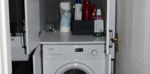 Tall Cupboard to house washing machine Open